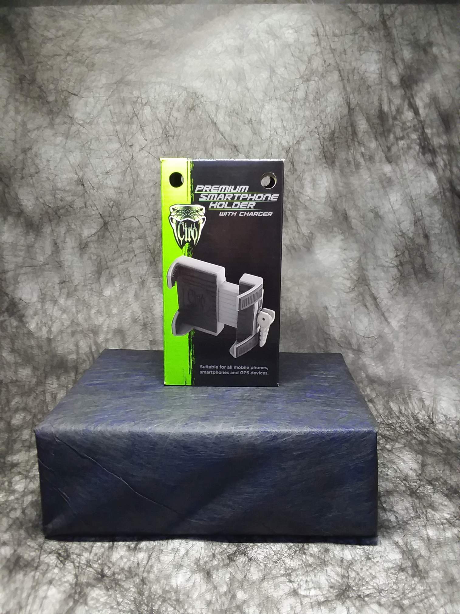 Pictured is the Ciro 3D Premium Smartphone Holder box, black with a green stripe down the left. The Ciro logo and mount appear on the front.