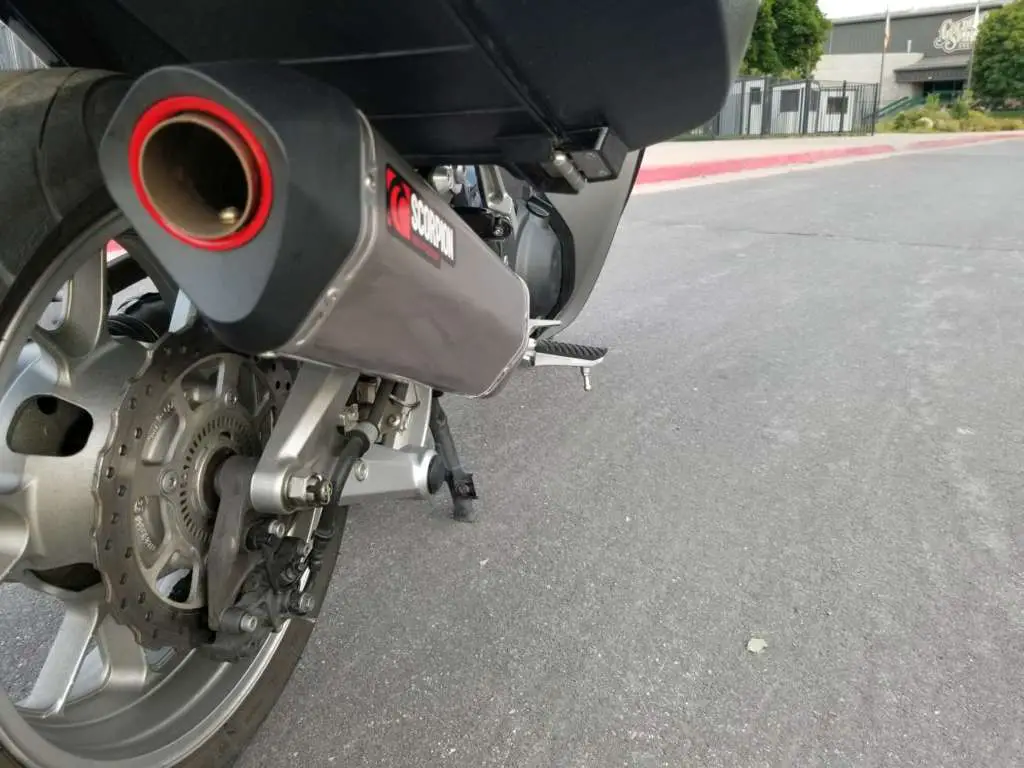 Closeup of the Scorpion RedPower exhaust from a low, rearward angle. Prominent is the bright red ring around the port.