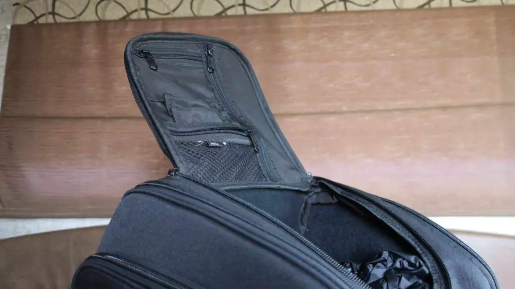 The lid of the Viking Sport Tail Bag is shown, displaying the office organizer on the underside. Zippered pockets and a mesh pouch are prominent.