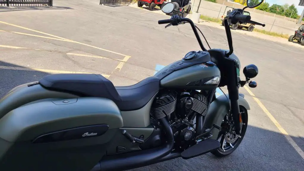 2020 Indian Springfield Dark Horse parked in the shade in a parking near other toys.