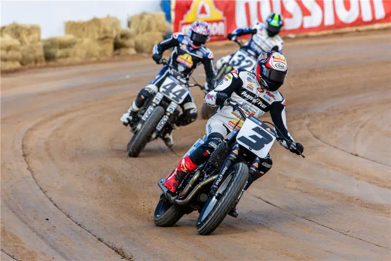 MILWAUKEE (August 11, 2025) – Rick Ware Racing/Parts Plus/Latus Motors rider Briar Bauman rode a Harley-Davidson® XG750R motorcycle to one win and two additional podium finishes during three nights of racing at the historic Jackpine Gypsies short track near Sturgis, S.D., earning vital points in the closely contested Mission SuperTwins championship battle in the 2025 Progressive American Flat Track (AFT) series. Bauman extended his SuperTwins series lead to seven points. Mission/Roof Systems rider Brandon Robinson also claimed a SuperTwins race win aboard a Harley-Davidson XG750R—his first victory on the bike after playing a key role in its long-term development. In the first AFT AdventureTrackers race of the season, WFOracingonline.com rider Jesse Janisch rode a Harley-Davidson Pan America® 1250 Special to a win and a runner-up finish as the series made its Sturgis debut. H-D Pan America riders Danny Eslick (Saddlemen Race Development) and Henry Wiles (Walters Bros. Harley-Davidson/Wiebler’s Harley-Davidson) also earned podium results. The tripleheader week of short track and TT racing was staged in conjunction with the 85th Annual Sturgis Motorcycle Rally. Bauman Adds to AFT SuperTwins Points Lead, Robinson Earns First Victory August 4 – The Sturgis AFT SuperTwins triple-header opened on August 4 with Jackpine Gypsies Short Track I. For the second time this season, the event featured the Mission Triple-Challenge format, with the SuperTwins field contesting three races: a 10-lap sprint opener, a 15-lap race, and a 20-lap final. Points escalated with each race, and championship points were awarded based on the combined totals. Bauman set the tone early, topping qualifying with a best lap of 13.435 seconds on the tight 1/5-mile Jackpine Gypsies oval—the shortest track on the 2025 AFT SuperTwins schedule. In the 10-lap sprint, he led from the start with Mission/Roof Systems/Harley-Davidson rider Brandon Robinson and Yamaha’s Dallas Daniels, his closest title rival, in pursuit. Daniels moved past Robinson after two laps, but Bauman had already opened a gap, stretching his lead to 1.329 seconds at the finish. Daniels took second, with Robinson in third. The 15-lap second race was twice red-flagged for on-track incidents. On the third restart, Bauman again took the lead, but Daniels executed a pass for the win mid-race. Bauman held on for second, 0.650 seconds behind Daniels, with Royal Enfield’s Max Whale in third. The 20-lap finale turned into a showdown between Bauman and Daniels, the two swapping the lead several times in the opening laps. Daniels then took control at the front, with Bauman close behind and Robinson, Whale, and Honda’s Trent Lowe in the mix. On lap 19, Bauman retook the lead and held off Daniels and Robinson to claim his second win of the night and the overall event victory with a 1-2-1 score—his sixth AFT SuperTwins win of the season. Daniels (2-1-2) placed second overall, with Robinson (3-4-3) third. “Dallas took me to school in the second Main Event,” said Bauman. “To come back and get him—he usually just builds momentum and gets better throughout the night—was huge. My Rick Ware Racing/Parts Plus/Latus Motors team worked really, really hard. We changed quite a bit of stuff even though we’d been fast all day. Dallas is so good. I’ve never been this stressed out all the time, but we’re out here, baby, and we’re working for it.” August 5 – AFT SuperTwins raced under its traditional format for Jackpine Gypsies Short Track II. Robinson paced the field in qualifying with a best lap of 13.081 seconds on the Mission/Roof Systems Harley-Davidson XG750R motorcycle. Robinson finished second to Daniels in the first heat race, and Bauman won his heat race. At the start of the main event Daniels led the field with Robinson, Bauman and KTM rider Davis Fisher battling on his rear wheel. Robinson passed Daniels to take the lead at the 7-minute mark and the trio of Robinson, Daniels and Bauman opened a gap on the field. At the 4-minute mark Bauman took a low line attempting to pass Daniels for second place and contact sent Daniels to the track. The race was stopped for a red flag, and Bauman and Daniels were penalized and sent to the back of the field for the restart. Robinson led away from the restart as Daniels and Bauman charged from the back row through a pack of 14 bikes. Bauman passed Daniels and worked his way up to third place in the closing laps, while Daniels finished 5th. Robinson crossed the finish line 1.151 seconds ahead of Fisher, with Bauman 1.634 seconds back in third place. Robinson’s win was the first for any rider this season other than title contenders Bauman and Daniels. August 8 – The Jackpine Gypsies facility was converted to a 0.35-mile TT course on a combination dirt and paved surface for the final event of the week, the Jackpine Gypsies Super TT. Bauman finished second to top qualifier Daniels in their heat race, and the pair of rivals lined up on the front row for the main event. Daniels led off the start as Wiles slotted into second with Bauman third. On the second lap Wiles missed a gear shift and Bauman charged past, giving chase to Daniels. Bauman could not quite match the pace set by Daniels on the very technical TT course and trailed by 5.781 seconds at the finish. Wiles finished third. Robinson left the race after 8 laps with a mechanical issue. After 12 of 16 rounds in the 2025 AFT Mission SuperTwins championship, Bauman leads with 243 points, followed by Daniels with 236. Robinson is third with 164 points. The AFT Mission SuperTwins series returns to action August 16 for the Peoria TT at the Peoria Motorcycle Club in Bartonville, Ill. Mission SuperTwins Race Results – Jackpine Gypsies Short Track I (Top 10) 1. Briar Bauman (H-D) Rick Ware Racing/Parts Plus/Latus Motors 2. Dallas Daniels (Yam) Estenson Racing 3. Brandon Robinson (H-D) Mission/Roof Systems/Harley-Davidson 4. Max Whale (RE) Moto Anatomy X Royal Enfield/Fairway Ford/Parts Unlimited 5. Henry Wiles (Yam) DL Racing/HYMMC 6. Trent Lowe (Hon) American Honda/Progressive Insurance/Mission Foods 7. Jarod VanDerkooi (KTM) Fastrack Racing/Wally Brown Racing 8. Davis Fisher (KTM) Rackley Racing/Bob Lanphere’s BMC Racing 9. Dan Bromley (Suz) Memphis Shades/Corbin/Vinson Construction 10. Logan McGrane (KTM) Schaeffer’s Motorsports Mission SuperTwins Race Results – Jackpine Gypsies Short Track II (Top 10) 1. Brandon Robinson (H-D) Mission/Roof Systems/Harley-Davidson 2. Davis Fisher (KTM) Rackley Racing/Bob Lanphere’s BMC Racing 3. Briar Bauman (H-D) Rick Ware Racing/Parts Plus/Latus Motors 4. Dan Bromley (Suz) Memphis Shades/Corbin/Vinson Construction 5. Dallas Daniels (Yam) Estenson Racing 6. Jarod VanDerkooi (KTM) Fastrack Racing/Wally Brown Racing 7. Trent Lowe (Hon) American Honda/Progressive Insurance/Mission Foods 8. Henry Wiles (Yam) DL Racing/HYMMC 9. Justin Jones (KTM) 1st Impressions Race Team/Elder Trucking 10. James Ott (Yam) G&G Racing/Yamaha Racing/Media Home Mission SuperTwins Race Results – Jackpine Gypsies Super TT (Top 10) 1. Dallas Daniels (Yam) Estenson Racing 2. Briar Bauman (H-D) Rick Ware Racing/Parts Plus/Latus Motors 3. Henry Wiles (Yam) DL Racing/HYMMC 4. Jarod VanDerkooi (KTM) Fastrack Racing/Wally Brown Racing 5. Dan Bromley (Suz) Memphis Shades/Corbin/Vinson Construction 6. Declan Bender (Yam) Memphis Shades/Black Hills Powersports 7. Max Whale (RE) Moto Anatomy X Royal Enfield/Fairway Ford/Parts Unlimited 8. James Ott (Yam) G&G Racing/Yamaha Racing/Media Home 9. Trent Lowe (Hon) American Honda/Progressive Insurance/Mission Foods 10. Logan McGrane (KTM) Schaeffer’s Motorsports Janisch Wins AFT AdventureTrackers Opener August 4 – WFOracingonlin.com rider Jesse Janisch rode a Harley-Davidson Pan America® 1250 Special to victory in the first round of the four-race 2025 AFT AdventureTrackers™ series, a professional racing class for large displacement, street-stock adventure touring motorcycles. In the single 10-lap main event, Janisch passed Suzuki rider Dan Bromley on the second lap and then held the lead as the pair battled for the rest of the race. Janisch, who had ridden a Pan America 1250 Special for back-country exploring in the Black Hills earlier in the day, won by 0.282 seconds. Triumph rider Dalton Gauthier finished third. “We’ve been having a blast,” said Janisch following the race. “I got to ride a Pan America 1250 all day yesterday out in the hills, enjoying the scenic views of Sturgis, which was amazing. I’ve got to thank everyone who helped us out. I had a good battle with Dan, and I’m stoked to get the first one.” August 5 – In the second AFT AdventureTrackers™ event Bromley and Janisch swapped results in the in the main event. Bromley pulled away from the field as Janisch battled for second place with Honda rider Austin Luczak and Walters Bros. Harley-Davidson/Wiebler’s Harley-Davidson rider Henry Wiles and Saddlemen Race Development rider Danny Eslick, both on Harley-Davidson Pan America 1250 Special motorcycles. By the time Janisch broke out of that pack Bromley had opened a lead that stretched to 1.465 seconds at the finish. Luczak finished third, 3.633 seconds behind Bromley. August 8 – Janisch and Bromley lined up on the front row for the AdventureTrackers™ Super TT main event (4 minutes plus 2 laps) in what was expected to be another battle for the two top riders in the class. Bromley led at the start with Janisch right on his wheel and looking for an opportunity to pass in the opening laps, but the fight was over after three laps when Janisch retired with a mechanical issue. Luczak and Harley-Davidson riders Eslick and Wiles took up the chase, but Bromley opened a gap on the field and crossed the finish line 3.596 second clear of Eslick with Wiles third. After three of four rounds in the 2025 AFT AdventureTrackers championship, Bromley leads with 65 points. Janisch is second with 51 points, followed by Eslick with 45 points, Luczak with 43 points, Wiles with 42 points and Gauthier with 41 points. The final race in the 2025 AFT AdventureTrackers series is scheduled for August 16 during the Peoria TT at the Peoria Motorcycle Club in Bartonville, Ill. AFT AdventureTrackers – Jackpine Gypsies Short Track I 1. Jesse Janisch (H-D) WFOracingonline.com 2. Dan Bromley (Suz) Big Momma and Daddy Deep Pockets 3. Dalton Gauthier (Tri) Triumph Racing 4. Austin Luczak (Hon) Memphis Shades/Black Hills Powersports 5. Henry Wiles (H-D) Walters Bros. Harley-Davidson/Wiebler’s Harley-Davidson 6. Danny Eslick (H-D) Saddlemen Race Development 7. Hunter Bauer (BMW) Vinson Construction/Memphis Shades 8. Brandon Paasch (Tri) Triumph Racing 9. Morgen Mischler (BMW) Memphis Shades/Corbin/Vinson Construction AFT AdventureTrackers – Jackpine Gypsies Short Track II 1. Dan Bromley (Suz) Big Momma and Daddy Deep Pockets 2. Jesse Janisch (H-D) WFOracingonline.com 3. Austin Luczak (Hon) Memphis Shades/Black Hills Powersports 4. Danny Eslick (H-D) Saddlemen Race Development 5. Henry Wiles (H-D) Walters Bros. Harley-Davidson/Wiebler’s Harley-Davidson 6. Chad Cose (H-D) Saddlemen Race Development 7. Dalton Gauthier (Tri) Triumph Racing 8. Hunter Bauer (BMW) Vinson Construction/Memphis Shades 9. Brandon Paasch (Tri) Triumph Racing 10. Morgen Mischler (BMW) Memphis Shades/Corbin/Vinson Construction AFT AdventureTrackers – Jackpine Gypsies Super TT 1. Dan Bromley (Suz) Big Momma and Daddy Deep Pockets 2. Danny Eslick (H-D) Saddlemen Race Development 3. Henry Wiles (H-D) Walters Bros. Harley-Davidson/Wiebler’s Harley-Davidson 4. Dalton Gauthier (Tri) Triumph Racing 5. Austin Luczak (Hon) Memphis Shades/Black Hills Powersports 6. Brandon Paasch (Tri) Triumph Racing 7. Chad Cose (H-D) Saddlemen Race Development 8. William Harris (BMW) Luczak Racing/Memphis Shades ### About Harley-Davidson Harley-Davidson, Inc. is the parent company of Harley-Davidson Motor Company and Harley-Davidson Financial Services. Our vision: Building our legend and leading our industry through innovation, evolution and emotion. Our mission: More than building machines, we stand for the timeless pursuit of adventure. Freedom for the soul. Since 1903, Harley-Davidson has defined motorcycle culture with an expanding range of leading-edge, distinctive and customizable motorcycles in addition to riding experiences and exceptional motorcycle accessories, riding gear and apparel. Harley-Davidson Financial Services provides financing, insurance and other programs to help get Harley-Davidson riders on the road.